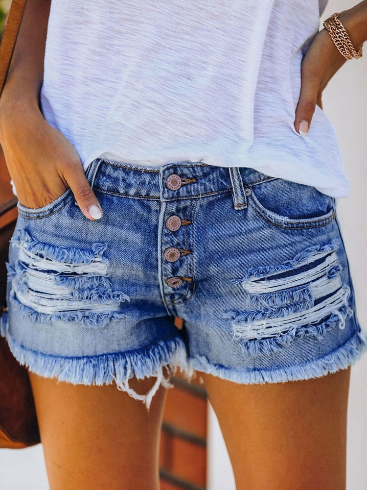 Petite high-rise denim shorts with distressing in blue