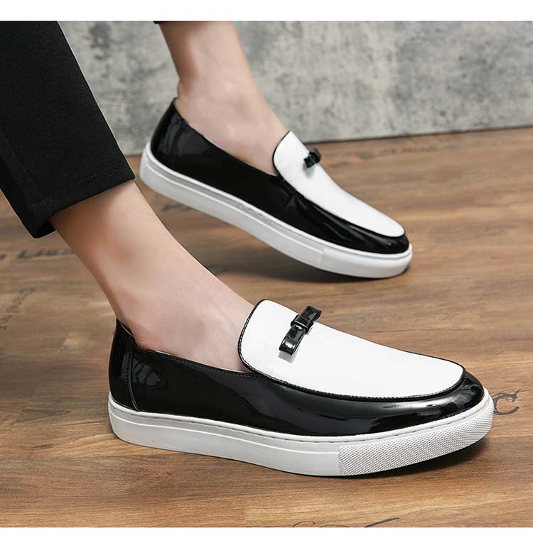 Patent leather slip-on loafers in black and white