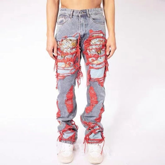Ripped jeans with patches red